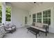 Covered porch with seating and wooded views at 175 Stonecrest Way, Pittsboro, NC 27312