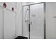 Modern bathroom shower stall with glass doors, sleek fixtures, and a built-in niche at 175 Stonecrest Way, Pittsboro, NC 27312
