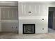 Spacious living room features a fireplace, neutral walls, and concrete flooring ready for your customization at 178 Seahawk Way, Zebulon, NC 27597