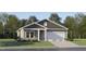 Charming single-story home with attached garage, neutral paint, shingle accents and landscaped front yard at 180 Digging Time Ave, Princeton, NC 27569