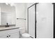 Updated bathroom showcasing gray countertop, black hardware, and a glass shower at 1812 Gazania Dr, Fuquay Varina, NC 27526