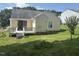 The backyard has an accessible deck area and ample grassy space at 1819 Collier Rd, Durham, NC 27707
