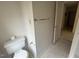 Tidy bathroom with a standard toilet, tile flooring, and a towel bar at 1819 Collier Rd, Durham, NC 27707