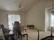 Bright living room with high ceilings and large windows offers ample natural light at 1819 Collier Rd, Durham, NC 27707