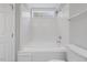 This is a full bathroom, all white, with tub and shower and tiled walls at 20 Nicklaus Way, Clayton, NC 27520
