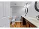 Bathroom with double vanity, wood-look floors, and ample counter space at 20 Nicklaus Way, Clayton, NC 27520
