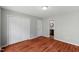 Bedroom featuring neutral walls, hardwood floors, and a closet at 20 Nicklaus Way, Clayton, NC 27520