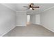 Bedroom displays plush carpet, ceiling fan, and neutral wall color at 20 Nicklaus Way, Clayton, NC 27520