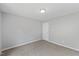 This bedroom has neutral walls, carpet, and ample space at 20 Nicklaus Way, Clayton, NC 27520