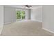 Bedroom features carpet and large windows providing ample natural light at 20 Nicklaus Way, Clayton, NC 27520