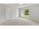 This is a bedroom with carpet, natural light, and large window view at 20 Nicklaus Way, Clayton, NC 27520
