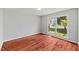 Spacious bedroom with hardwood floors and a large window offering natural light at 20 Nicklaus Way, Clayton, NC 27520