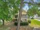 View of the rear exterior of the house with screened porch and yard at 20 Nicklaus Way, Clayton, NC 27520