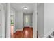 Welcoming foyer with hardwood floors, white trim and view of the front door at 20 Nicklaus Way, Clayton, NC 27520