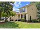 Beautiful two-story home with yellow siding, blue shutters, and a welcoming front porch at 20 Nicklaus Way, Clayton, NC 27520