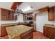 Kitchen displays granite countertops, hardwood floors, and stainless steel appliances at 20 Nicklaus Way, Clayton, NC 27520