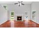 Living room showcases hardwood floors, fireplace, natural light, and neutral wall color at 20 Nicklaus Way, Clayton, NC 27520