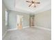 Large bedroom with tray ceiling, ceiling fan and doorway views to additional rooms at 204 Plantation Dr, Youngsville, NC 27596