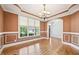 Dining room boasting hardwood floors, decorative moldings, and bright natural light at 204 Plantation Dr, Youngsville, NC 27596