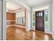 Elegant foyer with hardwood floors, decorative moldings, and a charming arched doorway at 204 Plantation Dr, Youngsville, NC 27596