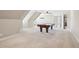 Spacious game room features a pool table, neutral paint, recessed lights and plush carpeting for a relaxing space at 204 Plantation Dr, Youngsville, NC 27596