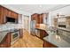 Modern kitchen with stainless appliances, granite countertops, and hardwood floors at 204 Plantation Dr, Youngsville, NC 27596