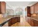 Well-equipped kitchen showcasing granite countertops and seamlessly flowing into adjacent living space at 204 Plantation Dr, Youngsville, NC 27596