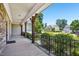 Covered porch offering neighborhood views and shade, with decorative wood supports at 204 Plantation Dr, Youngsville, NC 27596