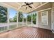 Screened porch with wood flooring, vaulted ceiling, ceiling fan and views of the backyard at 204 Plantation Dr, Youngsville, NC 27596