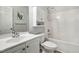 Clean bathroom featuring a shower-tub combo, white cabinets, and modern fixtures at 2069 White Pond Ct, Apex, NC 27523