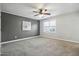 Bedroom with a ceiling fan, neutral carpet, and a large window at 2069 White Pond Ct, Apex, NC 27523