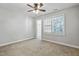 Bright bedroom with neutral walls, carpet, ceiling fan, and window views at 2069 White Pond Ct, Apex, NC 27523