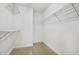 Bright walk-in closet featuring wire shelving for optimal storage and organization at 2069 White Pond Ct, Apex, NC 27523