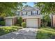 Charming townhouse with attached garage, neutral siding, black shutters, and well maintained landscaping at 2069 White Pond Ct, Apex, NC 27523