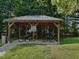 Community picnic gazebo in a serene, tree filled green space at 2069 White Pond Ct, Apex, NC 27523