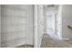Hallway with a storage closet and neutral carpet flooring at 2069 White Pond Ct, Apex, NC 27523