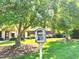 Charming community library box surrounded by lush greenery and trees at 2069 White Pond Ct, Apex, NC 27523