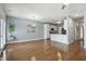 Open-concept living room and kitchen boasts hardwood floors and modern lighting at 2069 White Pond Ct, Apex, NC 27523