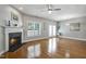 Spacious living room boasts hardwood floors, fireplace, ceiling fan and access to a patio at 2069 White Pond Ct, Apex, NC 27523