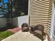 A cozy patio area with wicker furniture, great for enjoying the outdoors at 2069 White Pond Ct, Apex, NC 27523