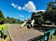 Community playground with slides, swings, and benches for relaxing at 2069 White Pond Ct, Apex, NC 27523