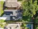 Aerial view of the property showcasing a large backyard, patio, pool and lush landscaping at 2114 Cowper Dr, Raleigh, NC 27608
