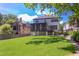 Expansive backyard featuring a well-maintained lawn and a screened porch perfect for outdoor gatherings at 2114 Cowper Dr, Raleigh, NC 27608