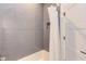 Modern bathroom features a tiled shower, a shower niche, and a shower curtain at 2114 Cowper Dr, Raleigh, NC 27608