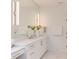 Bright bathroom featuring a long vanity, marble countertop, and ample storage at 2114 Cowper Dr, Raleigh, NC 27608