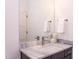 Modern bathroom features a marble countertop and a large mirror at 2114 Cowper Dr, Raleigh, NC 27608
