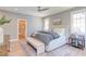 Spacious primary bedroom with a ceiling fan, walk-in closet and windows for natural light at 2114 Cowper Dr, Raleigh, NC 27608