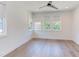 Bright bedroom with multiple windows, hardwood flooring, and recessed lighting at 2114 Cowper Dr, Raleigh, NC 27608