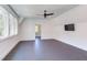 Bonus room offers flexible space with a ceiling fan and large windows for natural light at 2114 Cowper Dr, Raleigh, NC 27608