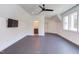 Bonus room offers flexible space with a ceiling fan and large windows for natural light at 2114 Cowper Dr, Raleigh, NC 27608